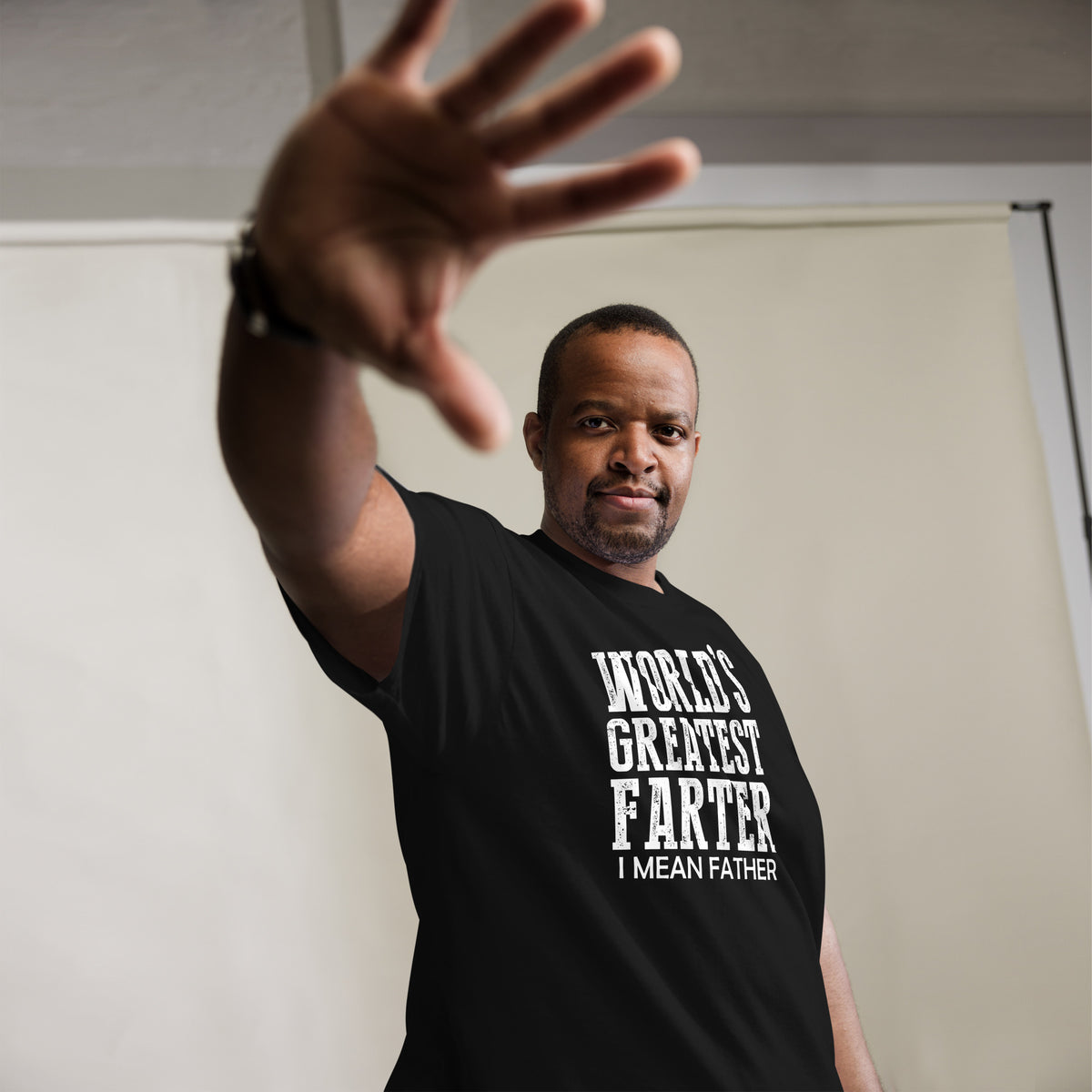 Black classic T-shirt, alternate front mockup, featuring white World's Greatest Farter, I Mean Father lettering.