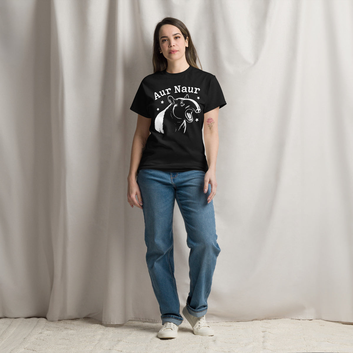 Black classic T-shirt, front view, featuring Aur Naur white tapir portrait, stars and lettering.