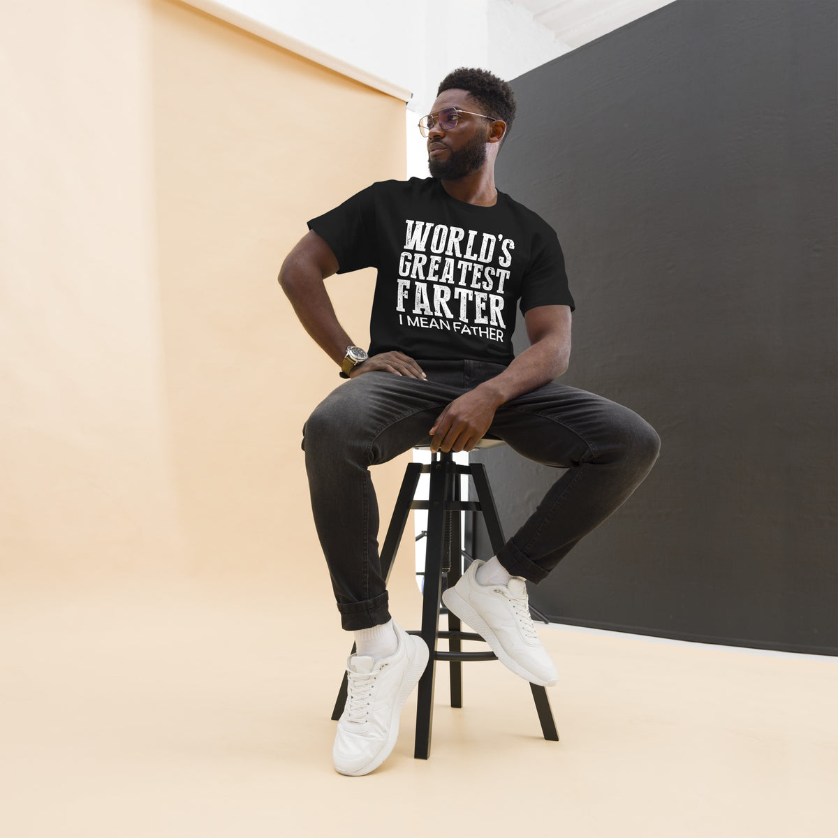 Black classic T-shirt, front view, featuring white World's Greatest Farter, I Mean Father lettering.