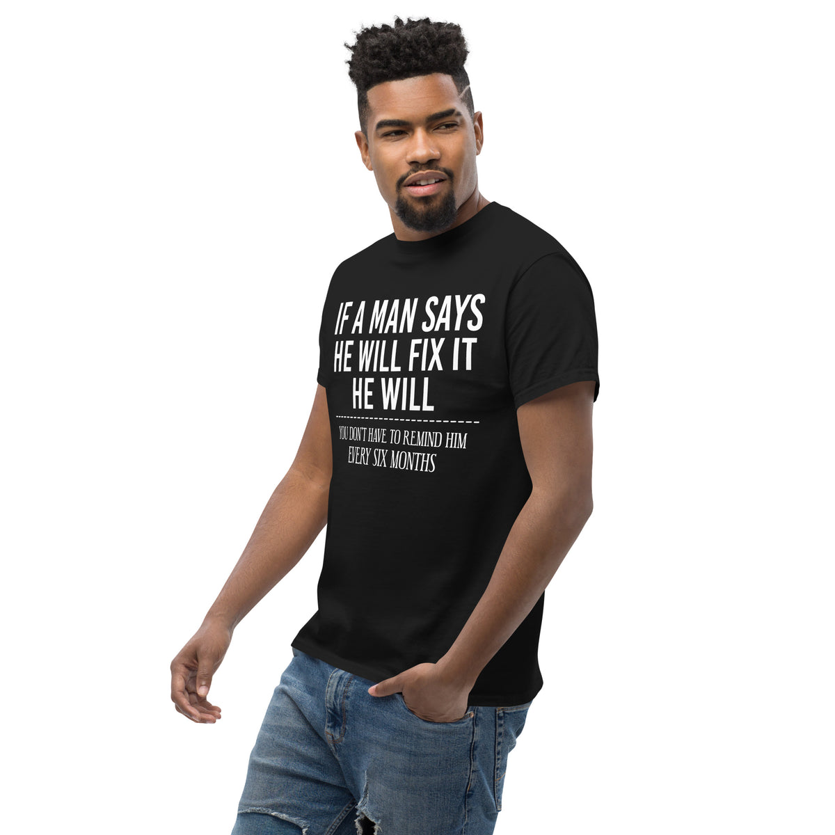 Black classic T-shirt, left-front angled view, featuring If a Man Says He Will Fix It six-month DIY reminder joke.