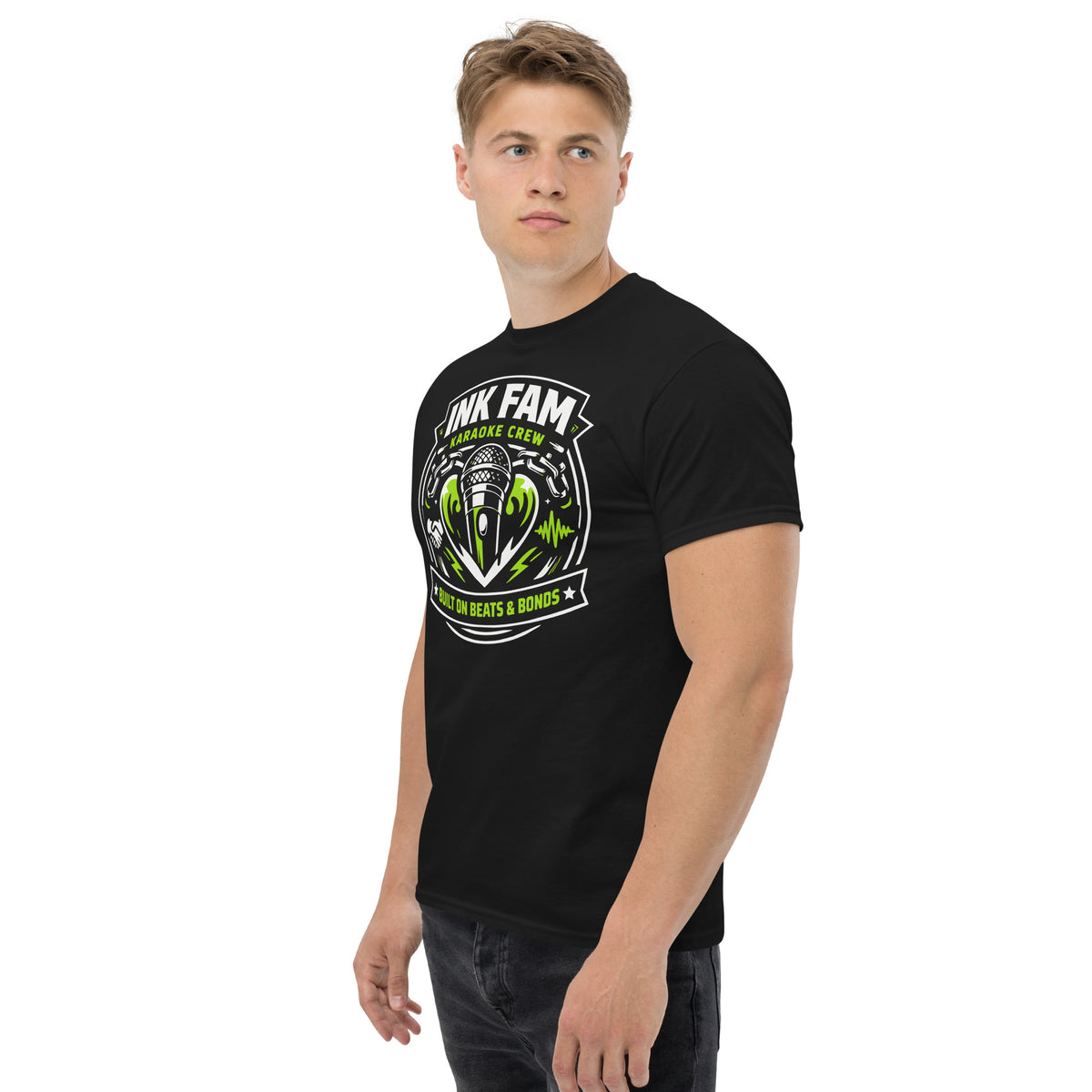 Black classic T-shirt, left-front angled view, featuring DJ Ink Beats & Bonds shield with a microphone and green-and-white lettering.