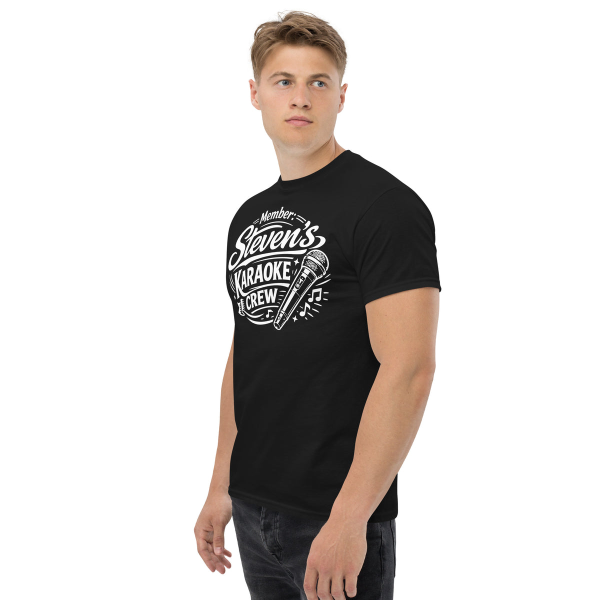 Black classic T-shirt, left-front angled view, featuring Steven's Karaoke Crew lettering and microphone graphic.