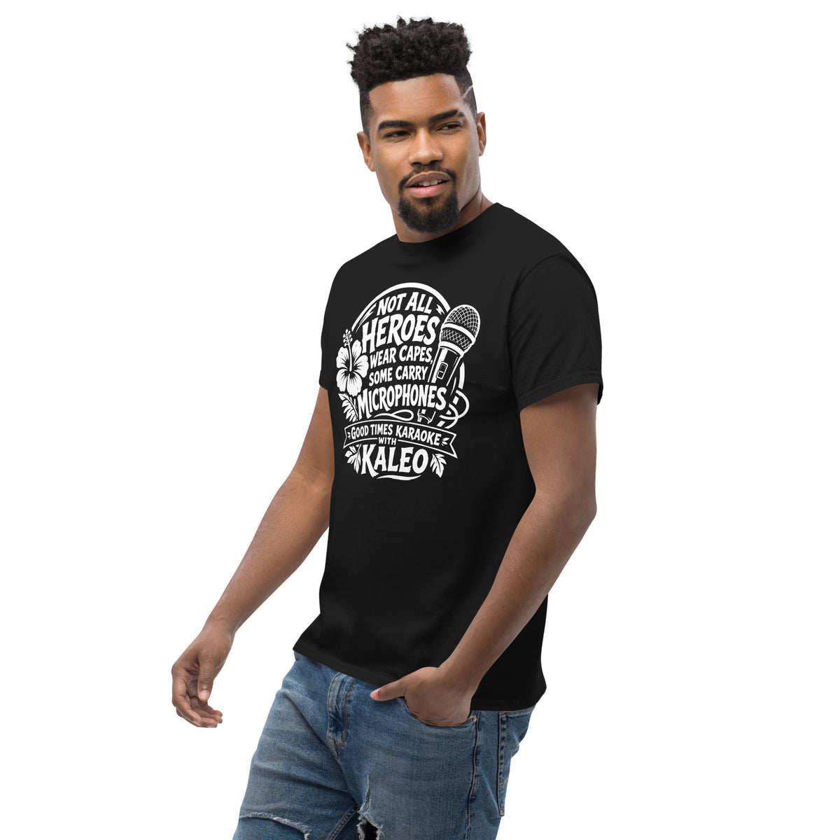 Black classic T-shirt, left-front angled view, featuring Kaleo's Karaoke Heroes 'Not All Heroes Wear Capes, Some Carry Microphones' graphic.