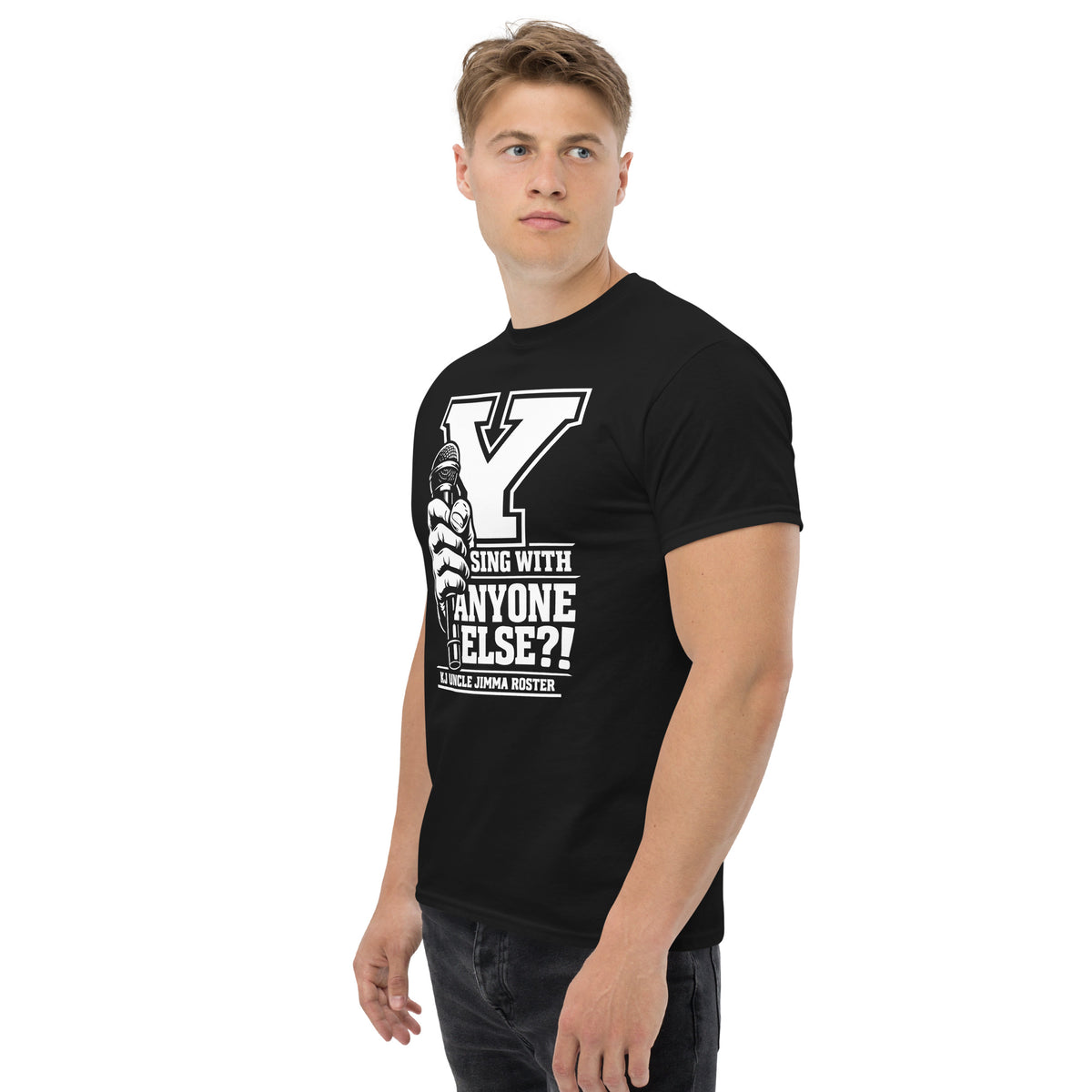 Black classic T-shirt, left-front angled view, featuring Uncle Jimma Roster Anthem varsity Y with hand-held microphone.