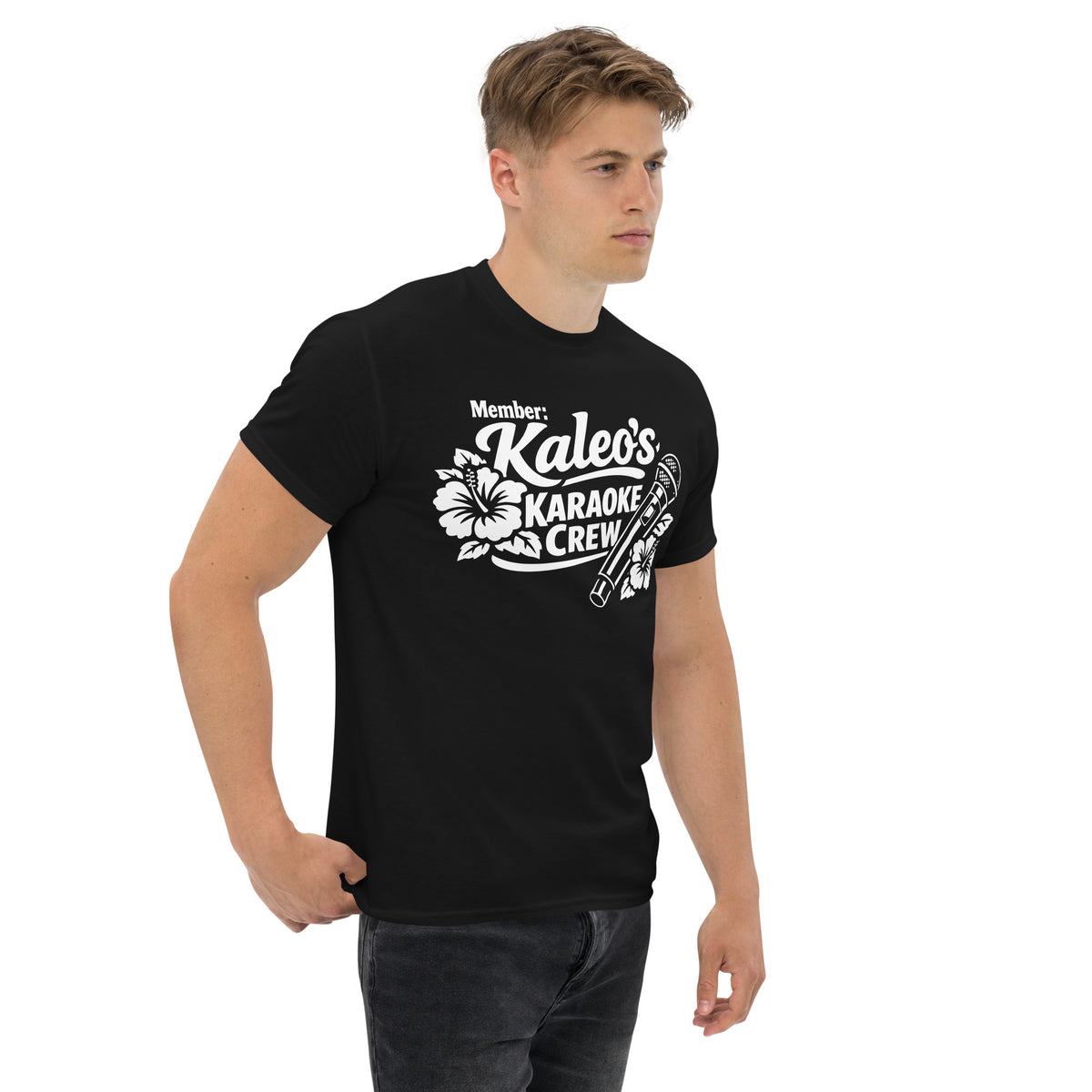 Black classic T-shirt, right-front angled view, featuring Kaleo's Karaoke Crew lettering, microphone, and hibiscus flowers.