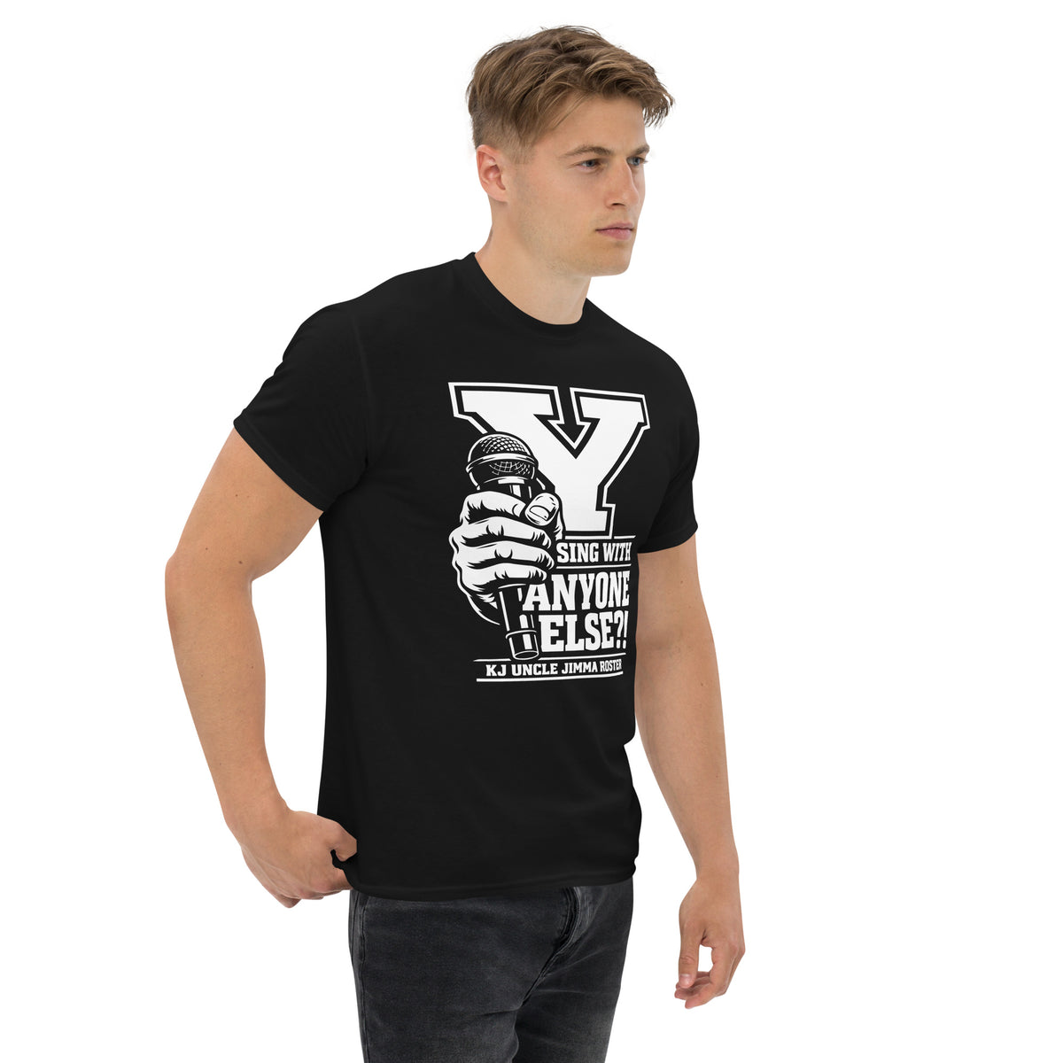 Black classic T-shirt, right-front angled view, featuring Uncle Jimma Roster Anthem varsity Y with hand-held microphone.