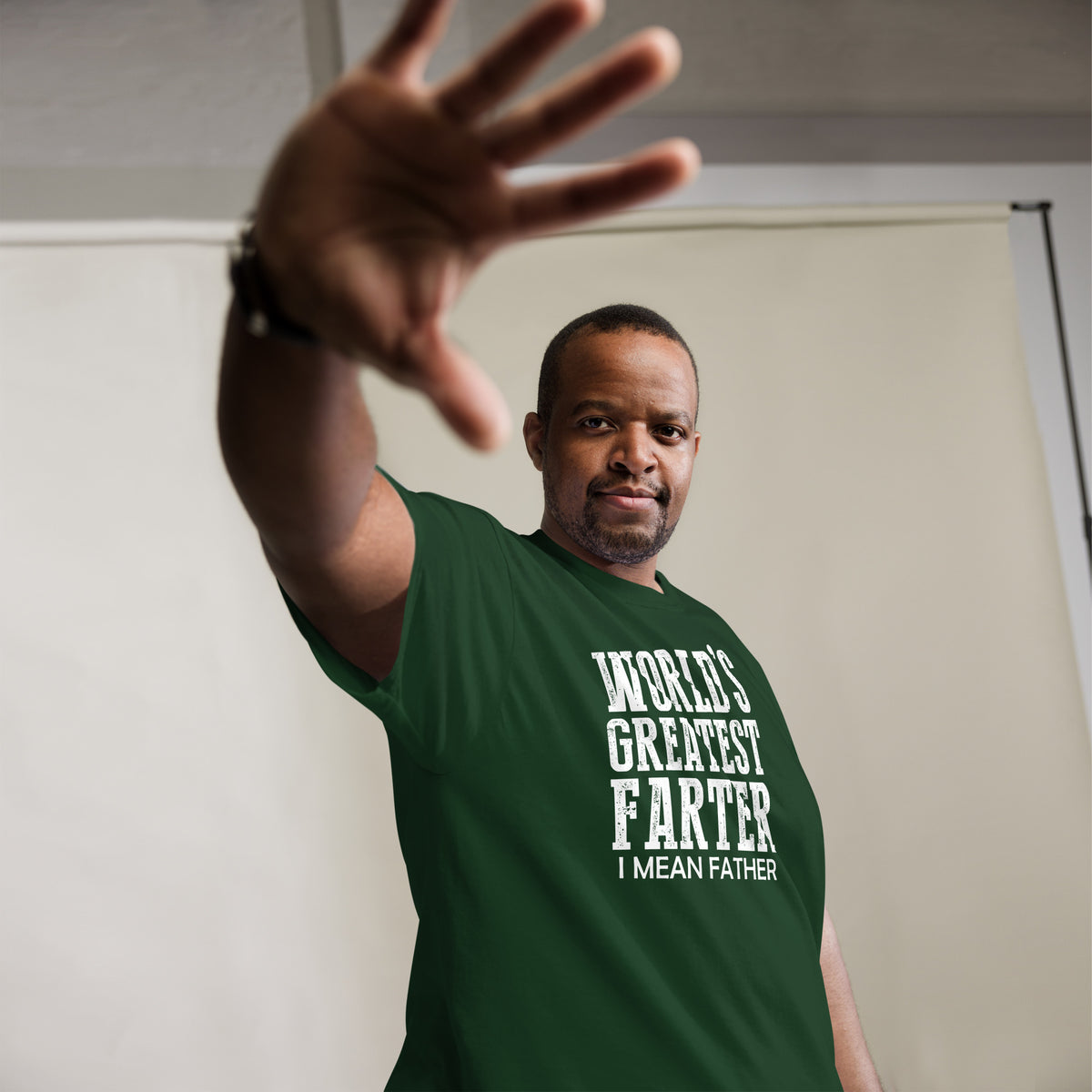 Forest Green classic T-shirt, alternate front mockup, featuring white World's Greatest Farter, I Mean Father lettering.