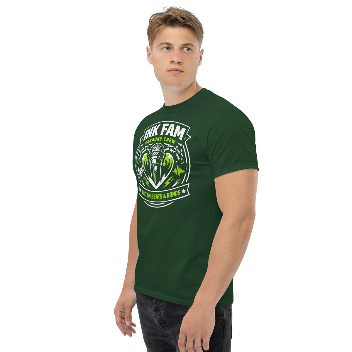 Forest Green classic T-shirt, left-front angled view, featuring DJ Ink Beats & Bonds shield with a microphone and green-and-white lettering.
