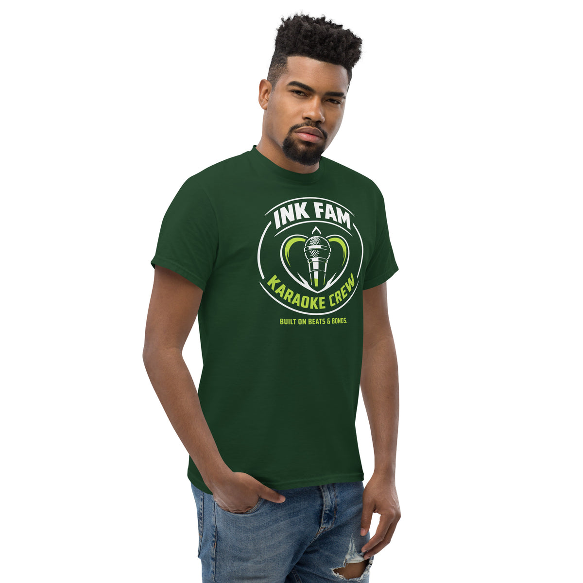 Forest Green classic T-shirt, right-front angled view, featuring DJ Ink Fam green-and-white circular microphone badge.