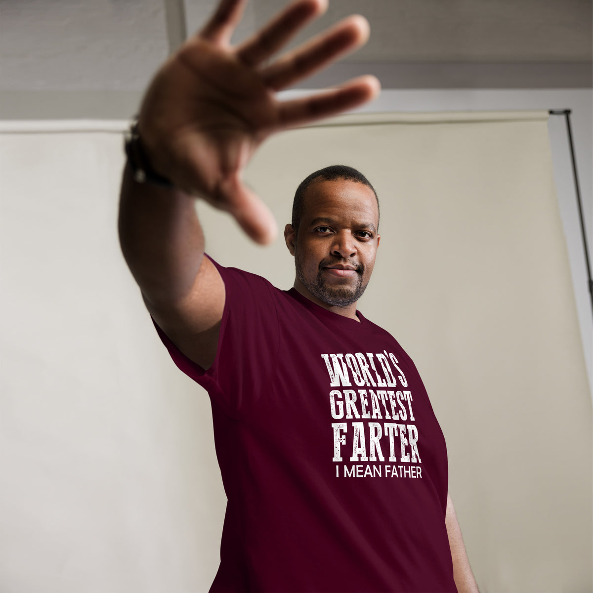 Maroon classic T-shirt, alternate front mockup, featuring white World's Greatest Farter, I Mean Father lettering.