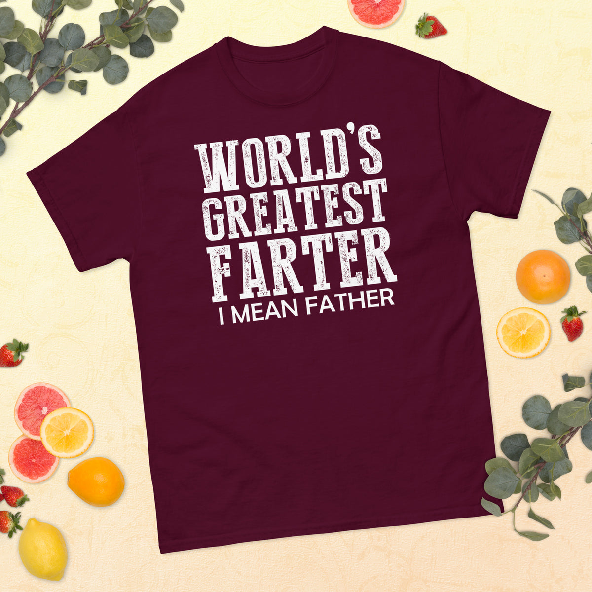 Maroon classic T-shirt, front view, featuring white World's Greatest Farter, I Mean Father lettering.
