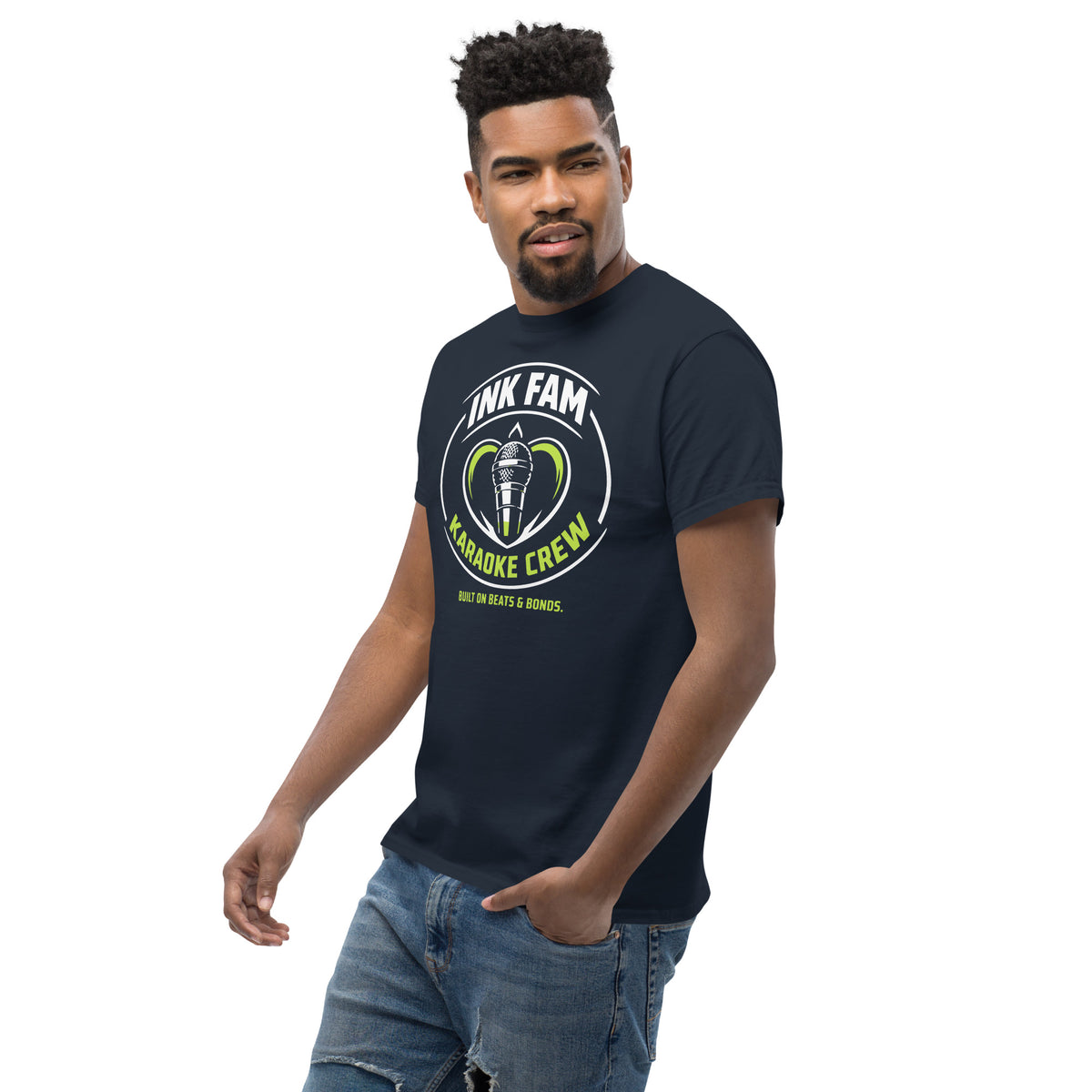 Navy classic T-shirt, left-front angled view, featuring DJ Ink Fam green-and-white circular microphone badge.