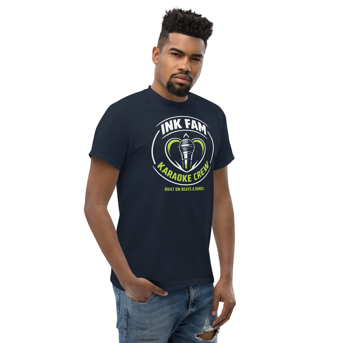 Navy classic T-shirt, right-front angled view, featuring DJ Ink Fam green-and-white circular microphone badge.