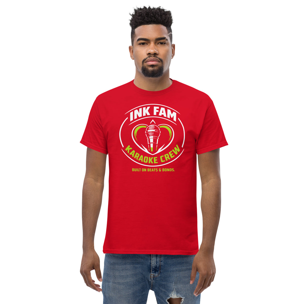 Red classic T-shirt, front view, featuring DJ Ink Fam green-and-white circular microphone badge.
