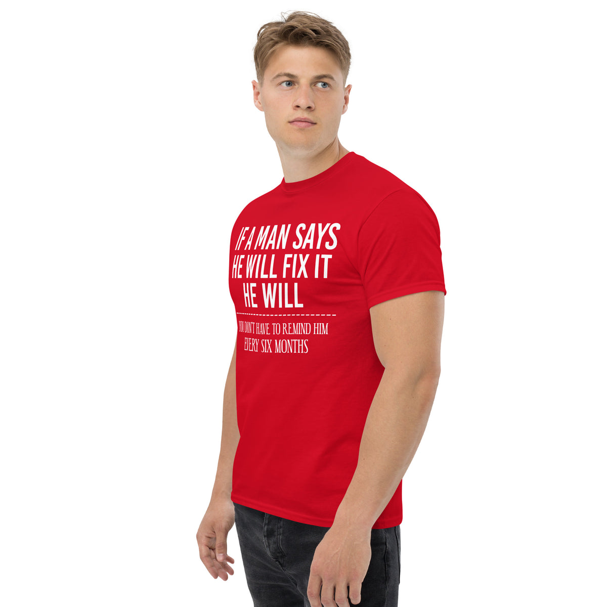 Red classic T-shirt, left-front angled view, featuring If a Man Says He Will Fix It six-month DIY reminder joke.