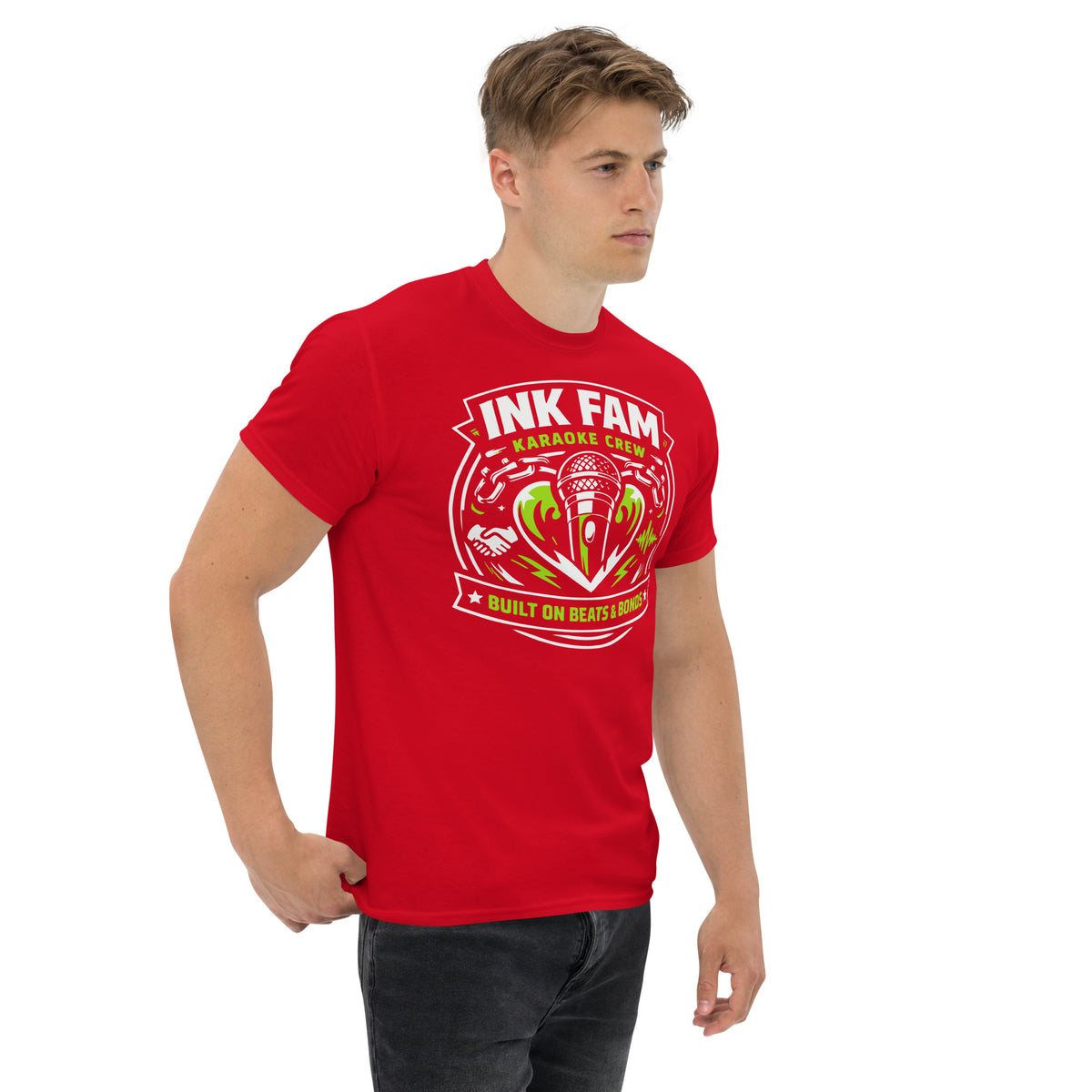 Red classic T-shirt, right-front angled view, featuring DJ Ink Beats & Bonds shield with a microphone and green-and-white lettering.