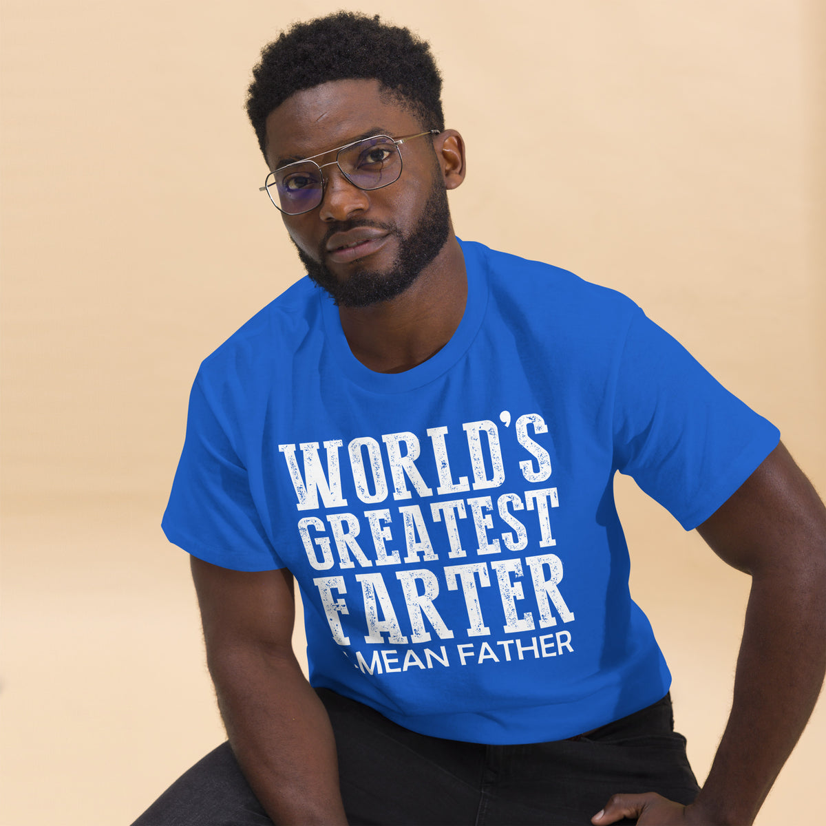 Royal classic T-shirt, alternate front mockup, featuring white World's Greatest Farter, I Mean Father lettering.