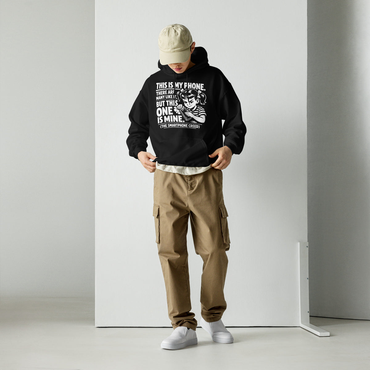 Black pullover hoodie, front view, showing a mockup for Smartphone Creed retro woman holding a phone and statement lettering.
