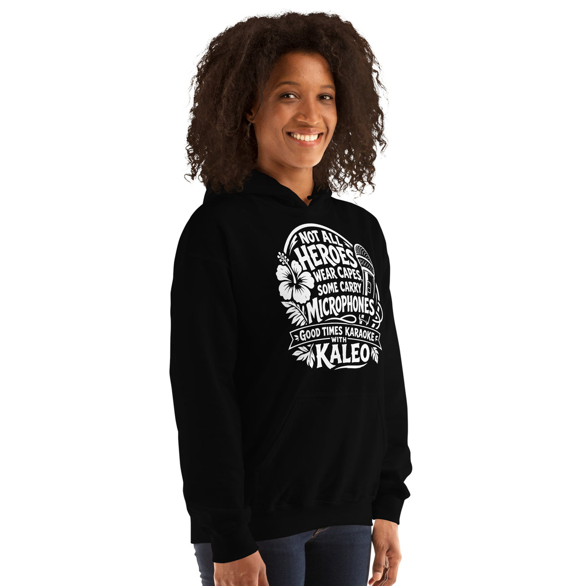 Black pullover hoodie, right-front angled view, featuring Kaleo's Karaoke Heroes 'Not All Heroes Wear Capes, Some Carry Microphones' graphic.