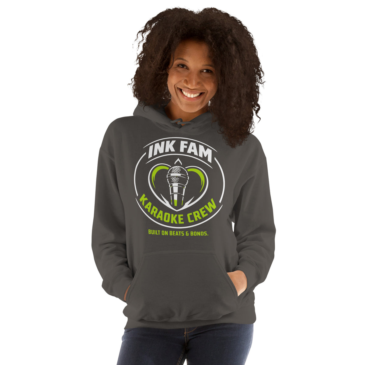 Charcoal pullover hoodie, front view, featuring the green-and-white circular DJ Ink Fam microphone badge.