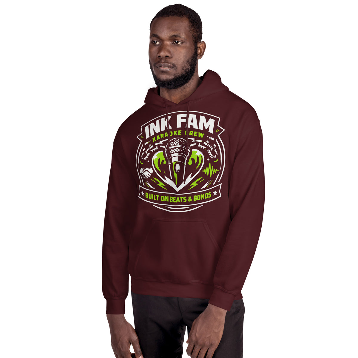 Maroon pullover hoodie, alternate front view, featuring DJ Ink Beats & Bonds shield with a microphone and green-and-white lettering.