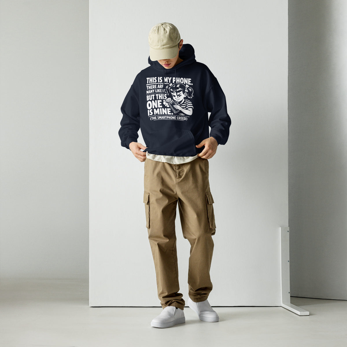Navy pullover hoodie, front view, showing a mockup for Smartphone Creed retro woman holding a phone and statement lettering.