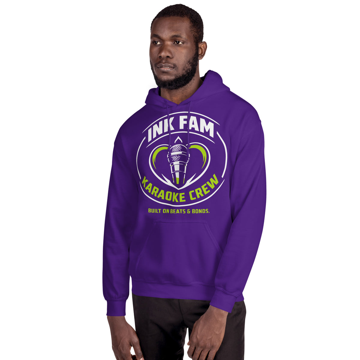 Purple pullover hoodie, alternate front mockup, featuring the green-and-white circular DJ Ink Fam microphone badge.