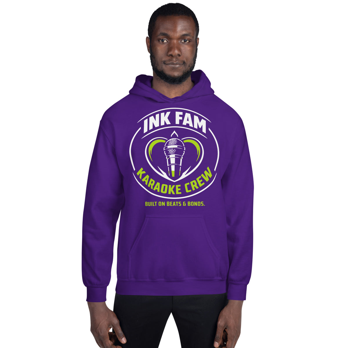 Purple pullover hoodie, front view, featuring the green-and-white circular DJ Ink Fam microphone badge.