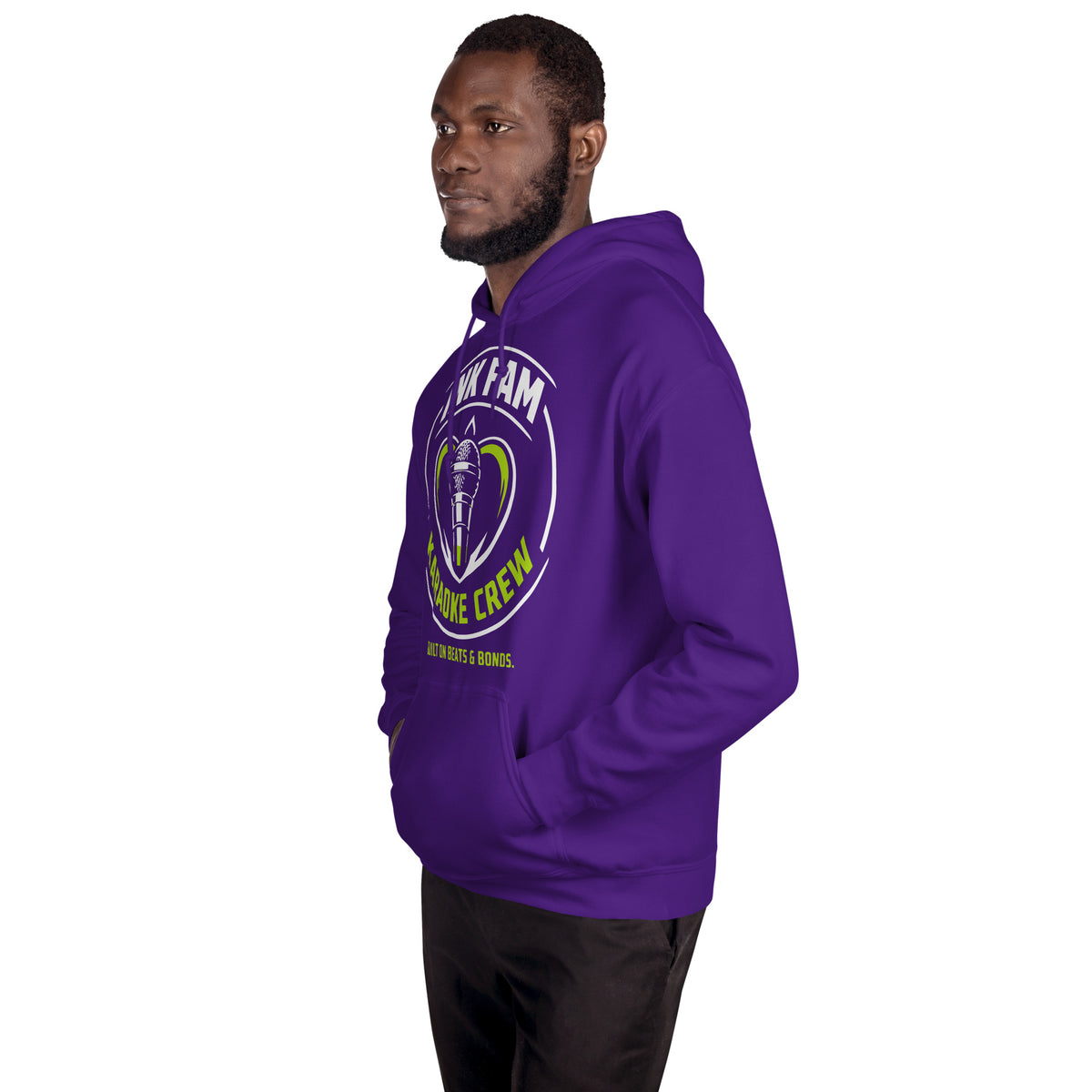 Purple pullover hoodie, left-front angled view, featuring the green-and-white circular DJ Ink Fam microphone badge.