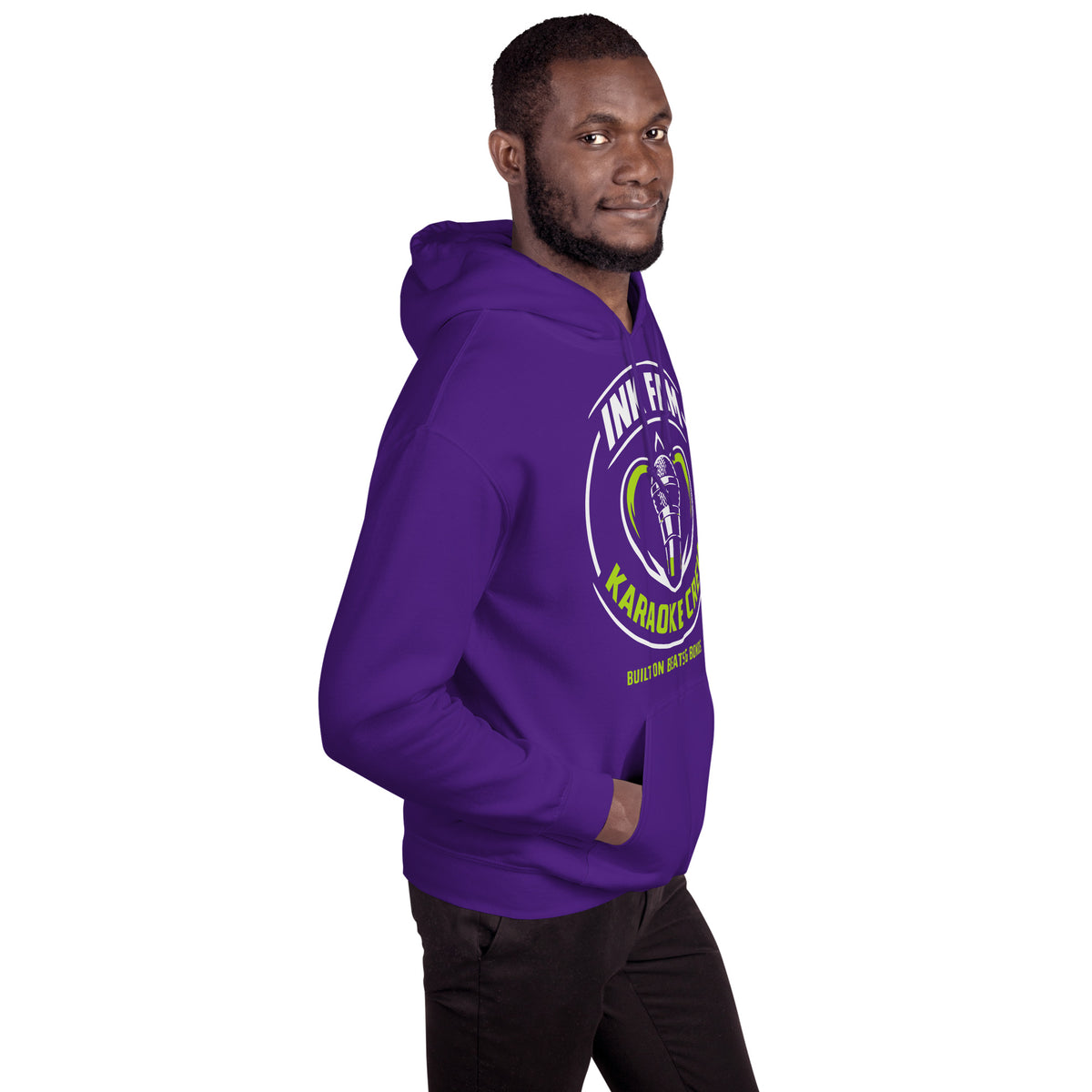 Purple pullover hoodie, right-front angled view, featuring the green-and-white circular DJ Ink Fam microphone badge.