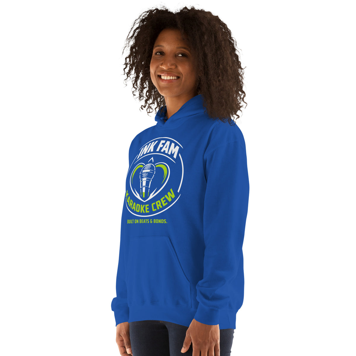 Royal pullover hoodie, left-front angled view, featuring the green-and-white circular DJ Ink Fam microphone badge.