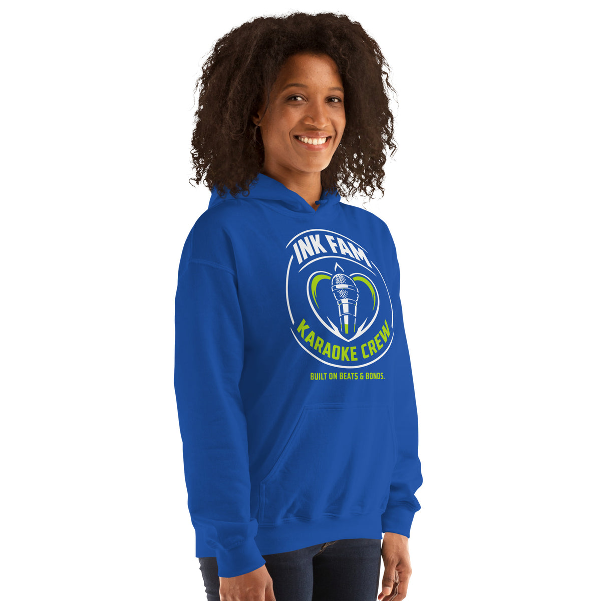 Royal pullover hoodie, right-front angled view, featuring the green-and-white circular DJ Ink Fam microphone badge.