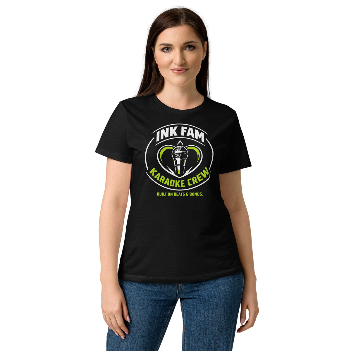 Black women's T-shirt, front view, featuring DJ Ink Fam green-and-white circular microphone badge.