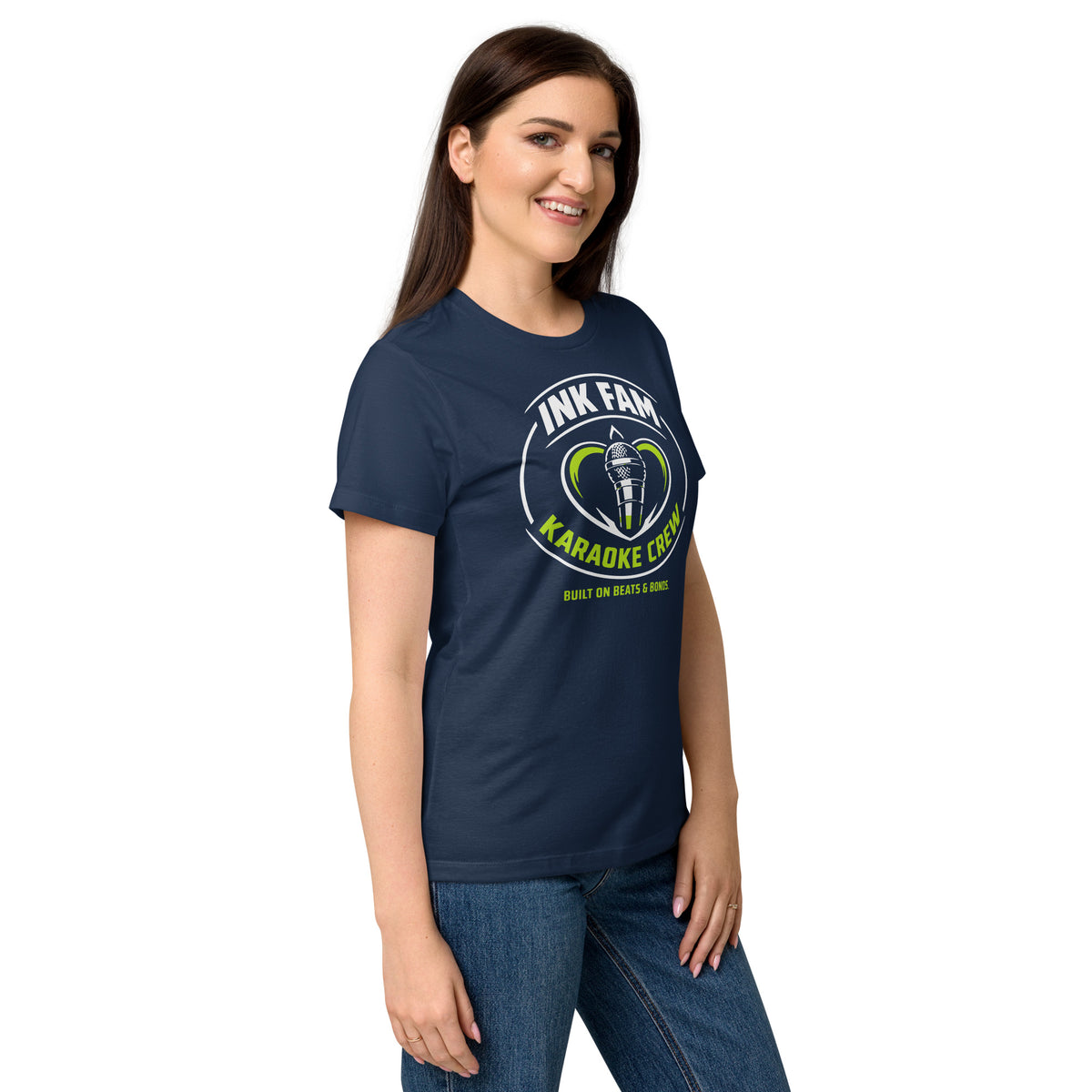 Navy women's T-shirt, right-front angled view, featuring DJ Ink Fam green-and-white circular microphone badge.