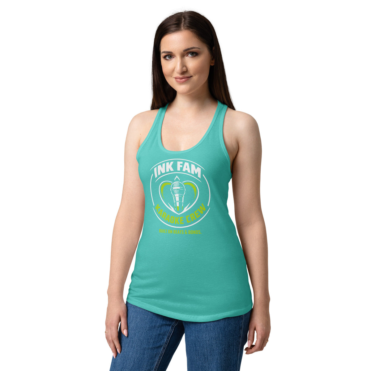 Tahiti Blue women's racerback tank top, front view, featuring DJ Ink Fam green-and-white circular microphone badge.