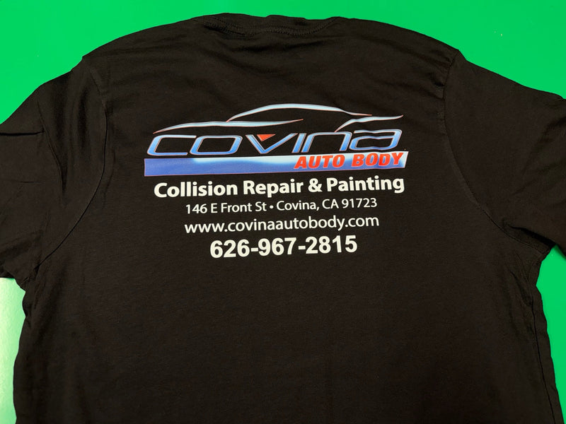 Back of a black Covina Auto Body Lane Seven Deluxe work shirt printed by Minty Tees