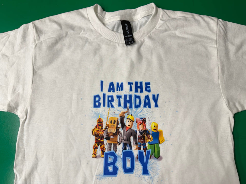 White birthday boy T-shirt with blue lettering and game characters.