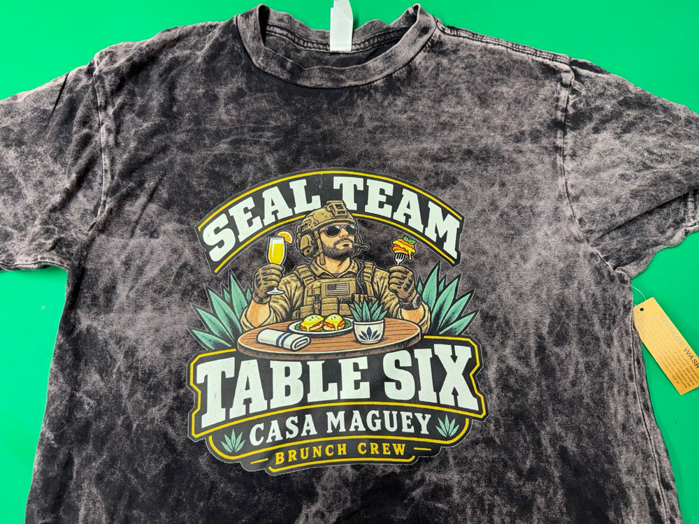 Washed dark T-shirt with a colorful SEAL Team Table Six Casa Maguey Brunch Crew design featuring a soldier enjoying brunch.