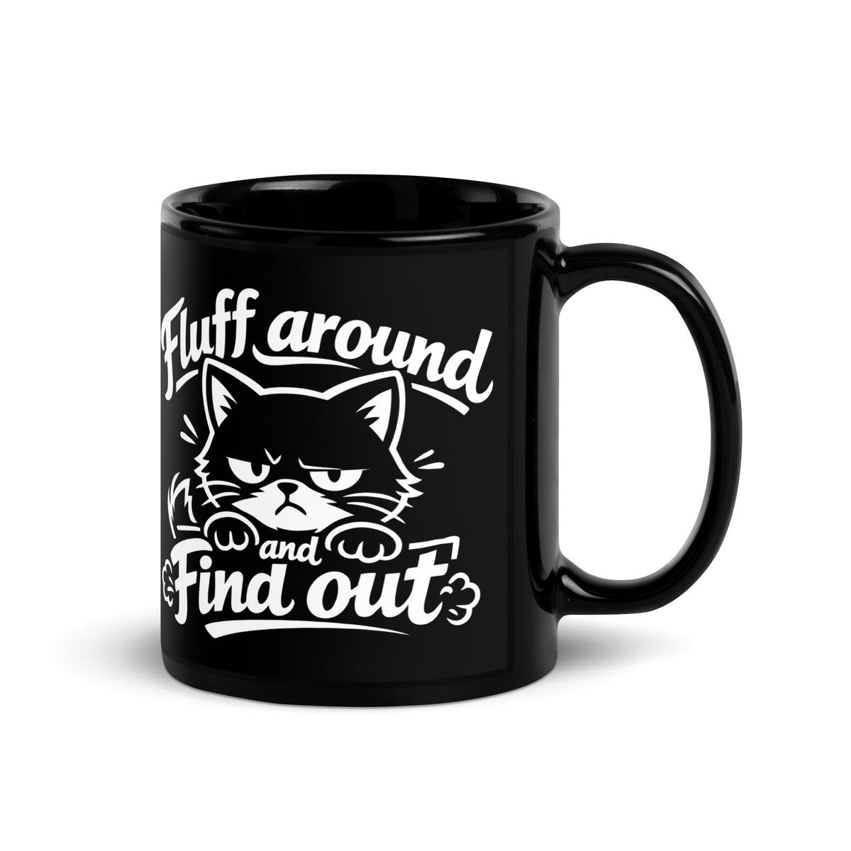 Black glossy mug, 11 oz, handle on right view, featuring a grumpy fluffy cartoon cat peeking over an edge with a twitching tail, under script Fluff Around and Find Out lettering