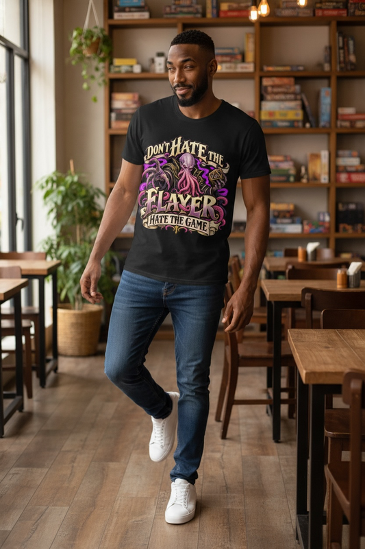 Man in the black Don't Hate the Flayer, Hate the Game classic tee in a board game cafe
