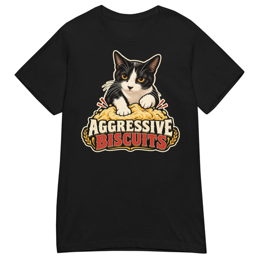 Black women's T-shirt, front view, featuring a black and white tuxedo cat with amber eyes kneading a mound of golden dough, under vintage bakery badge lettering reading Aggressive Biscuits